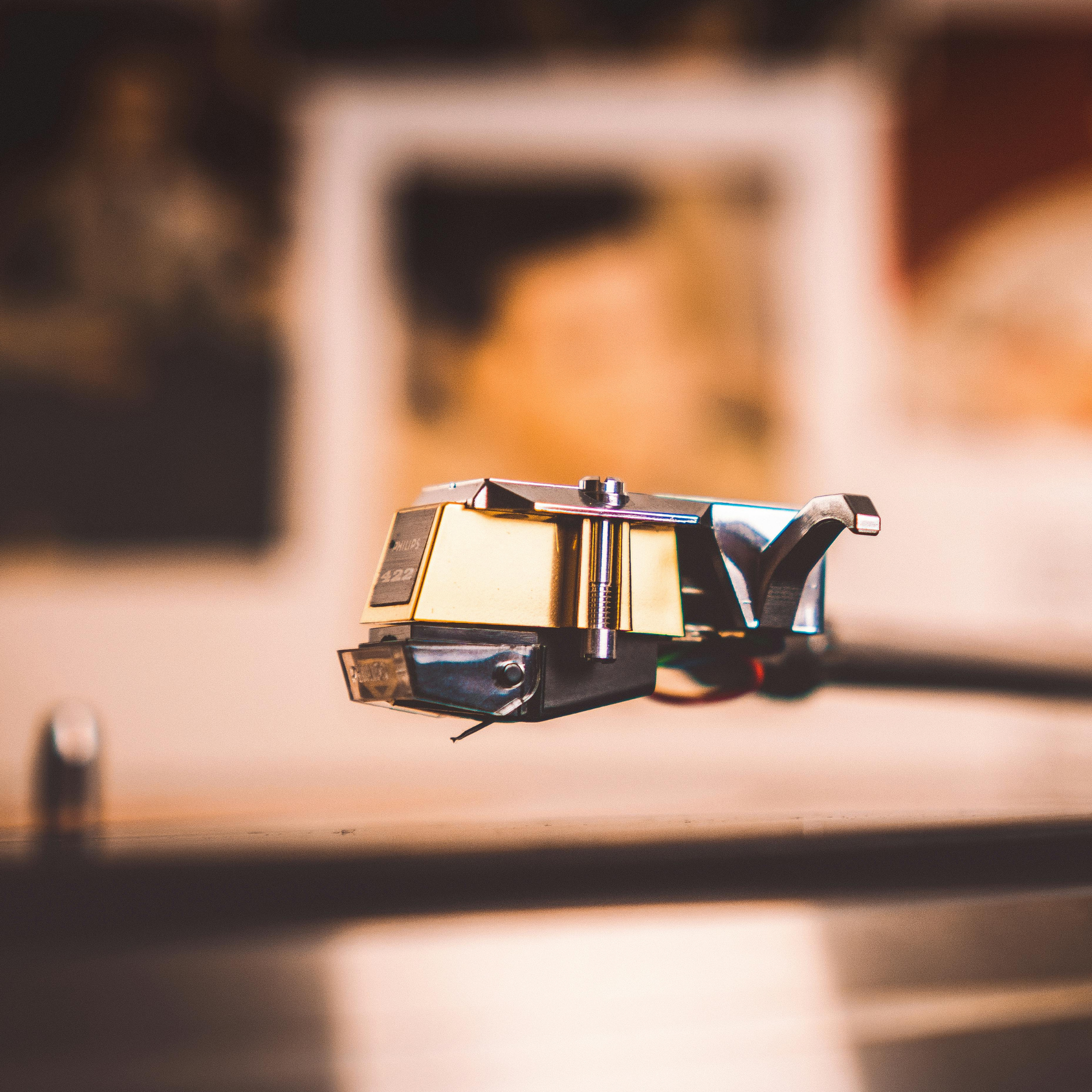 A stylus just about to drop on vinyl record