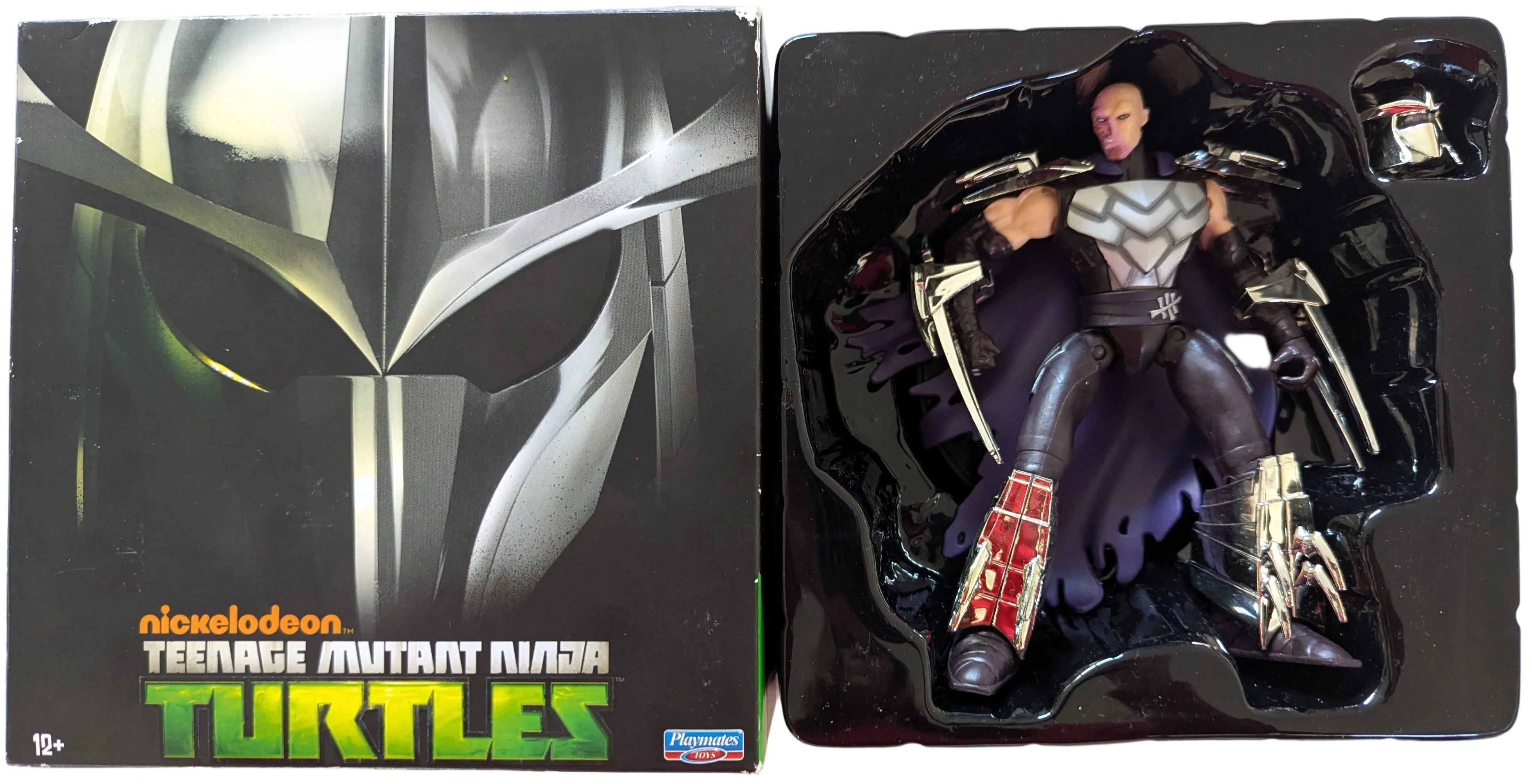 Teenage Mutant Ninja Turtles action figure set showing the illustrated box on the left and the figure in its black plastic blister packaging on the right. The figure is wearing a gray and black bodysuit.