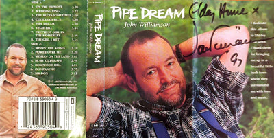 John Williamson – Pipe Dream Limited Ed Bonus Pack Autographed 2 Cassette (Bonus Behind The Dream Cassette)