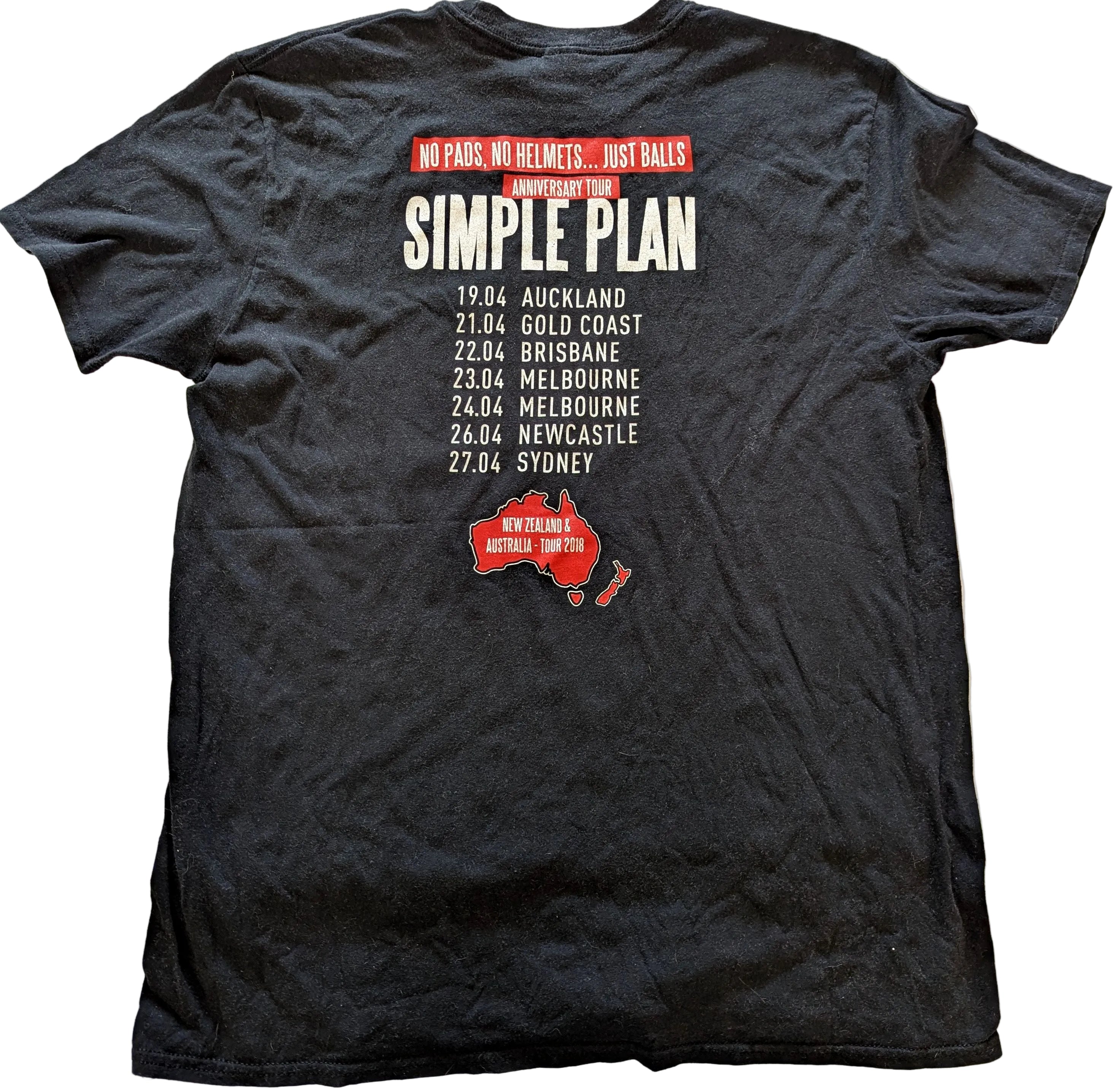 Black t-shirt with 'Simple Plan' tour dates and map on a white background